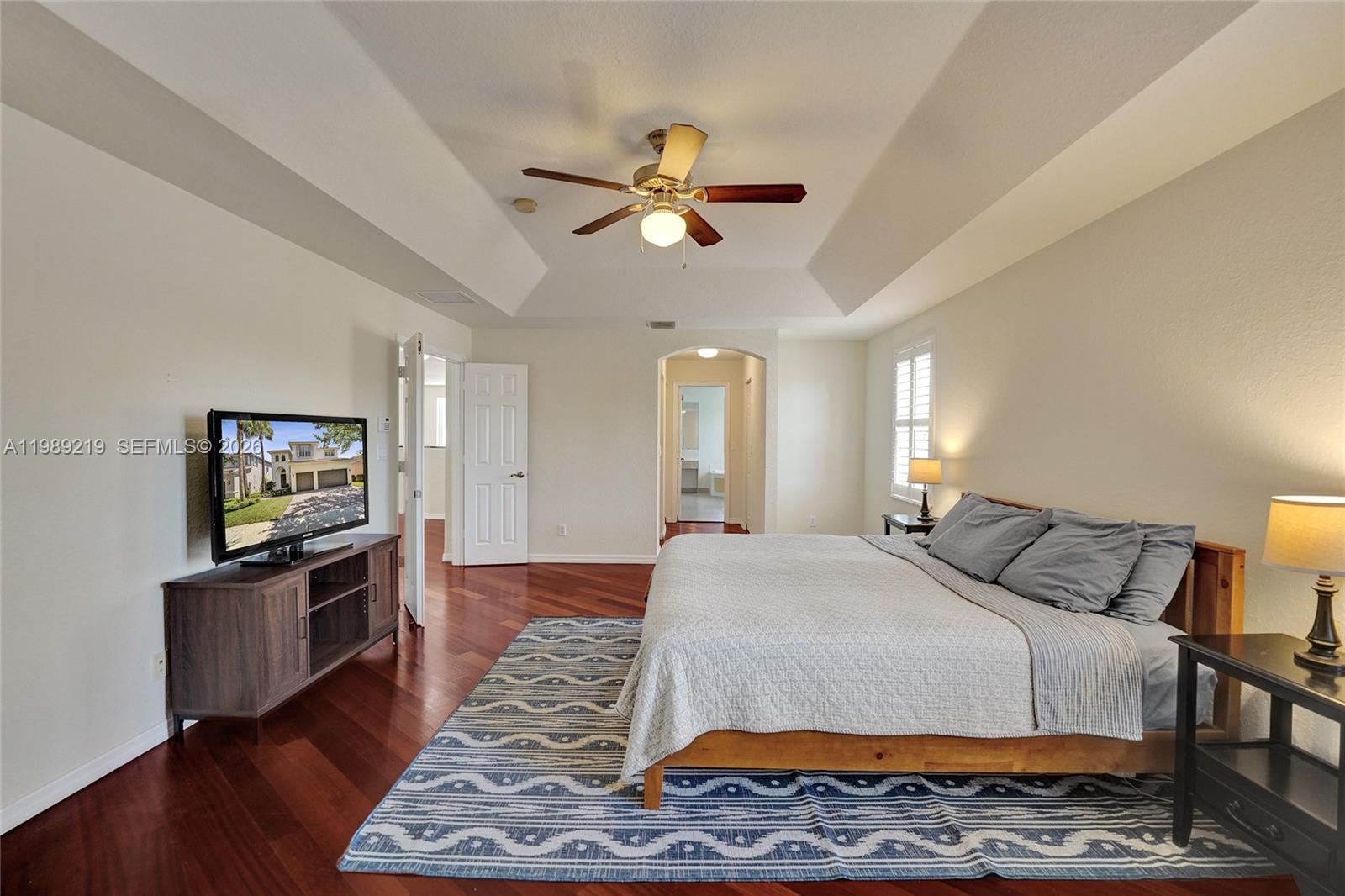3936 Cascade Terrace Weston, FL 33332 - Photo 51 of 90 a bedroom with a bed and a flat screen tv