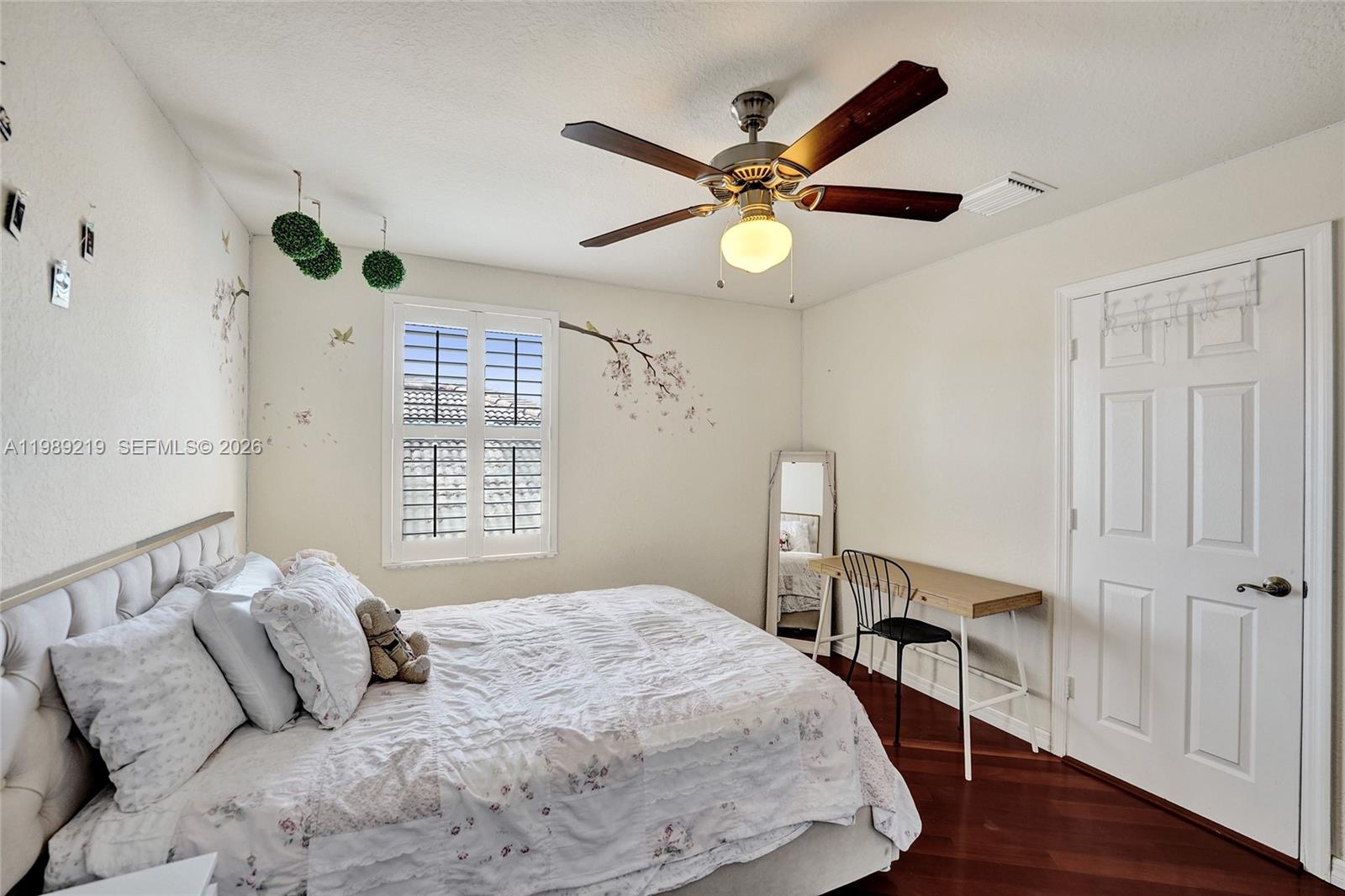 3936 Cascade Terrace Weston, FL 33332 - Photo 55 of 90 a bedroom with a large bed and a chandelier