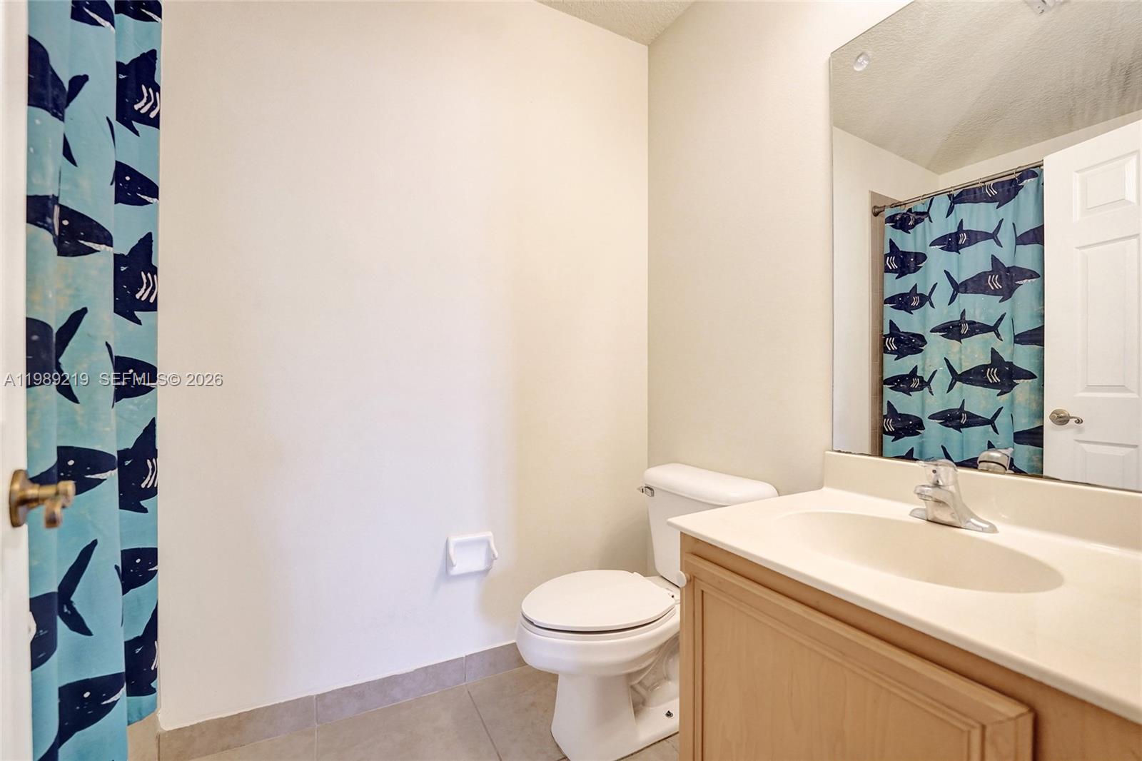 3936 Cascade Terrace Weston, FL 33332 - Photo 60 of 90 a bathroom with a sink and mirror with toilet