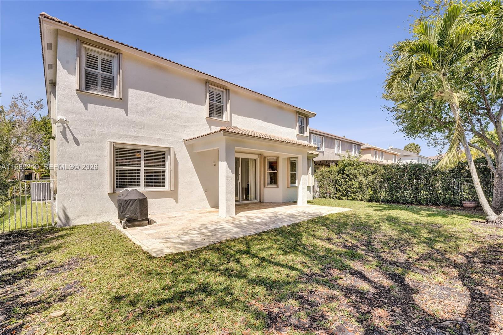 3936 Cascade Terrace Weston, FL 33332 - Photo 69 of 90 a front view of a house with a yard and garage