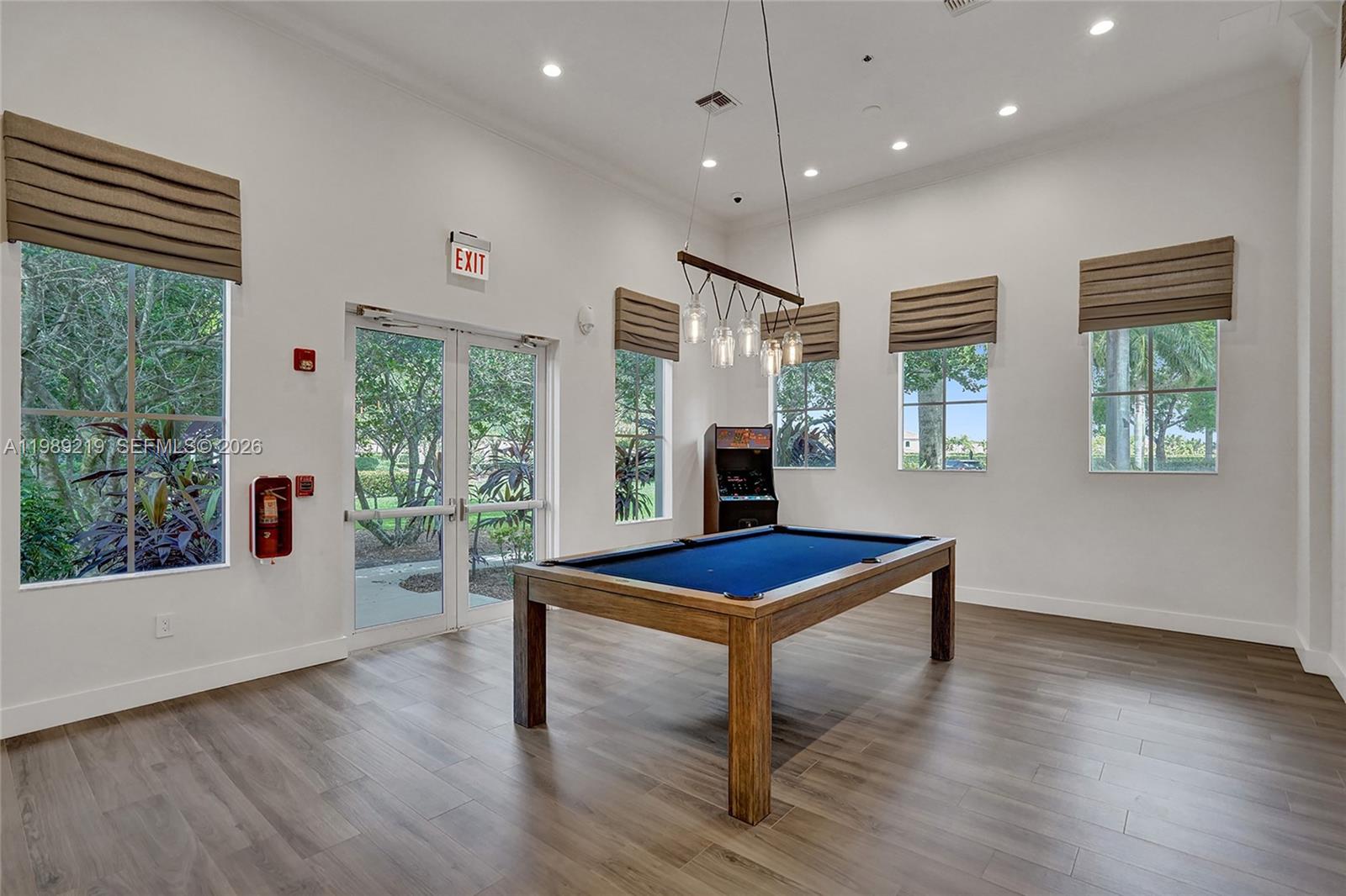 3936 Cascade Terrace Weston, FL 33332 - Photo 77 of 90 a view of an empty room with window wooden floor and front door
