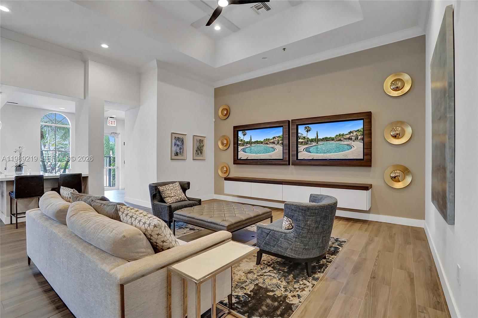 3936 Cascade Terrace Weston, FL 33332 - Photo 78 of 90 a living room with furniture and a flat screen tv
