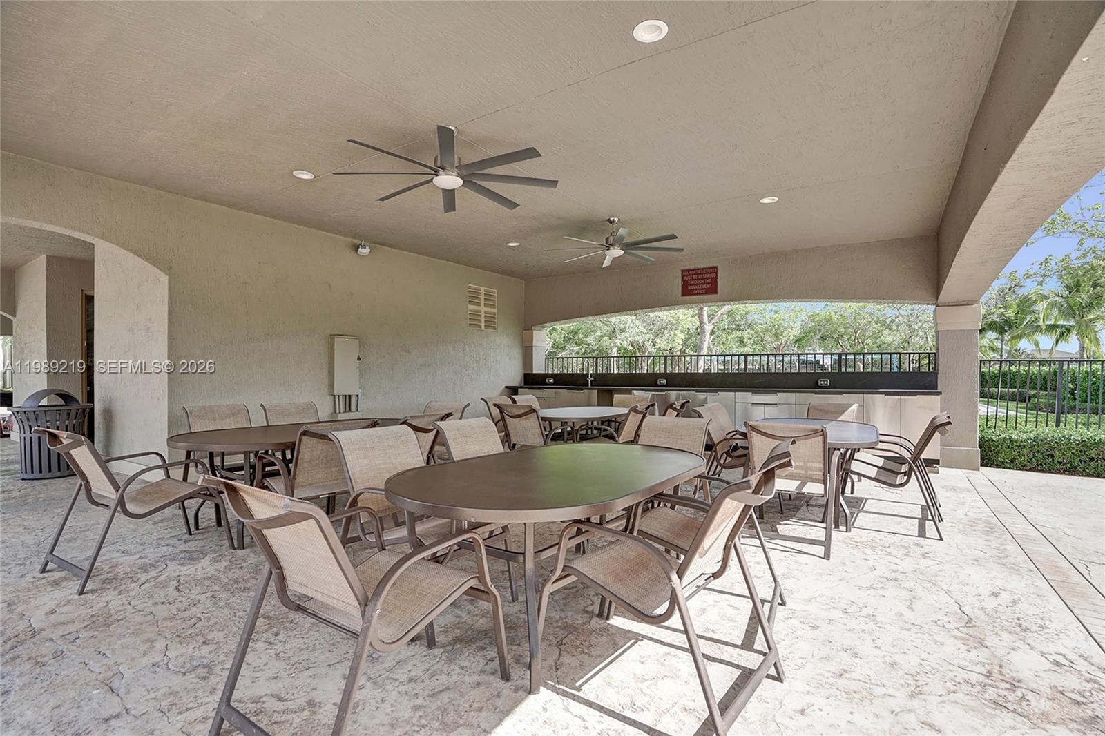3936 Cascade Terrace Weston, FL 33332 - Photo 87 of 90 a dining room with a table and chairs