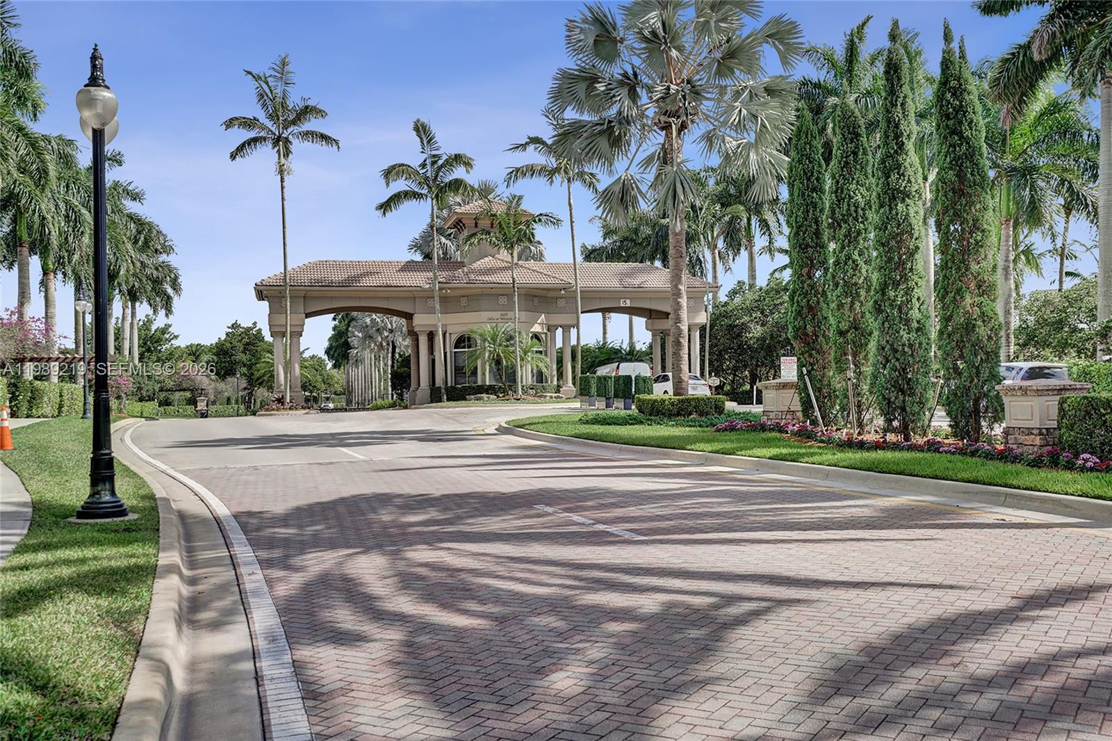 3936 Cascade Terrace Weston, FL 33332 - Photo 88 of 90 a view of a house with a yard and palm trees