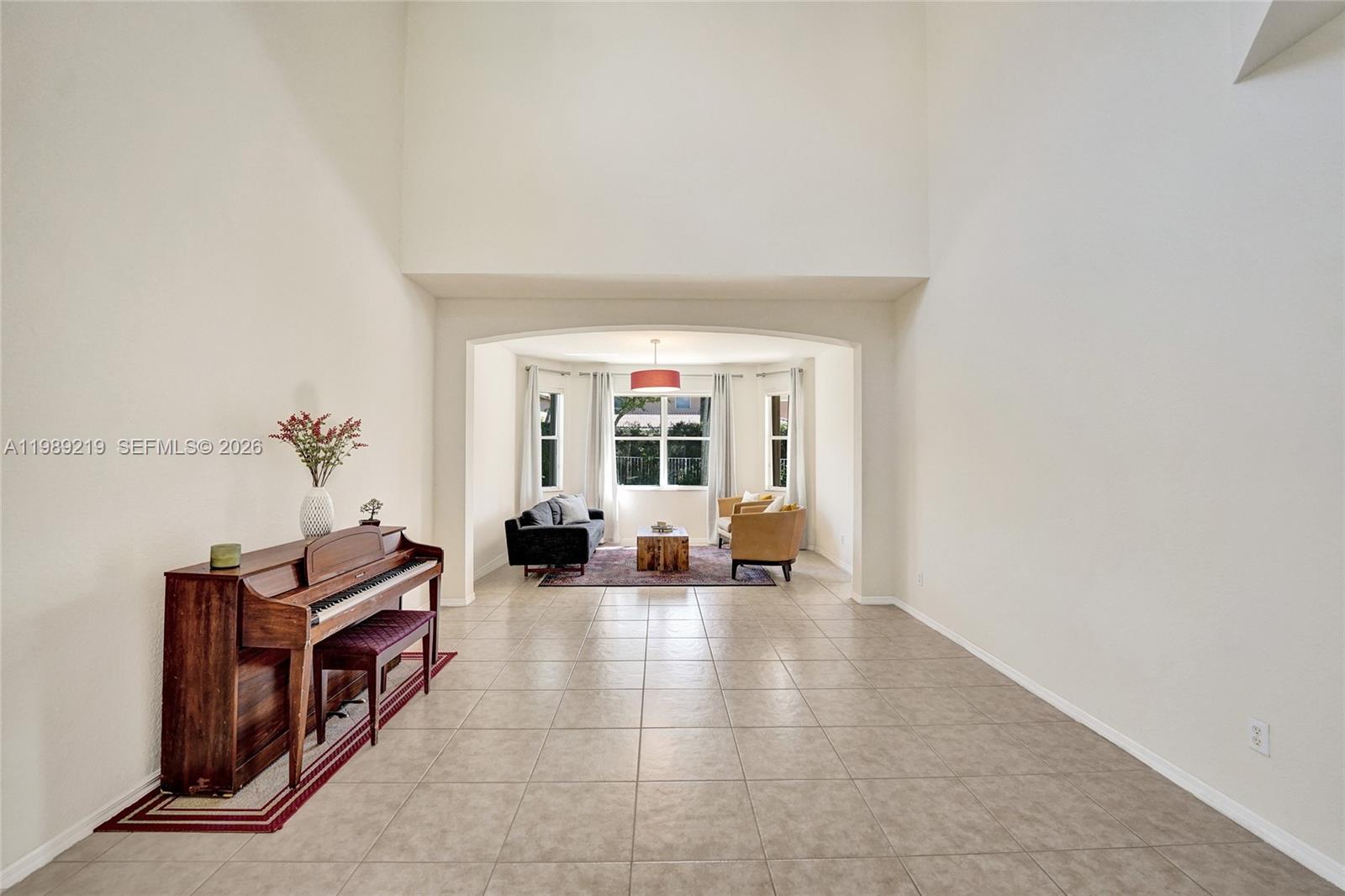 3936 Cascade Terrace Weston, FL 33332 - Photo 10 of 90 a living room with furniture and a large window