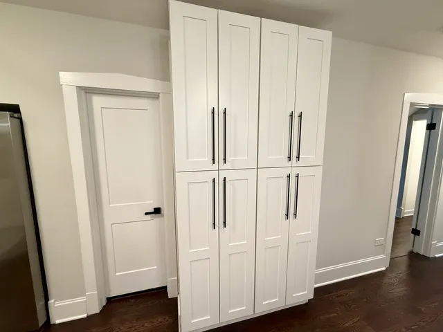 an entryway with wooden floor