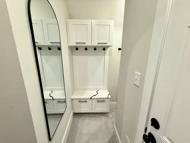 a bathroom with a tub mirror and a sink