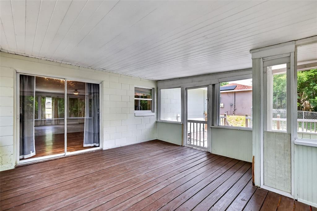 36 Bay Ridge Loop Mascotte, FL 34753 - Photo 25 of 32 an empty room with wooden floor and windows