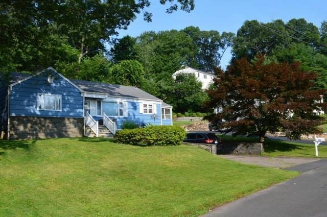 151 Bayberry Road Fairfield, CT 06825 - Photo 1 of 1 a front view of a house with a yard