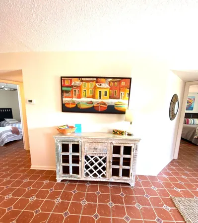 a living room with furniture rug and window
