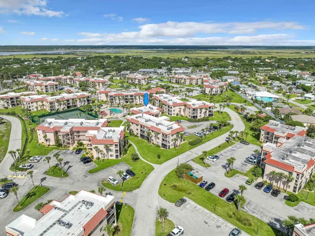 a view of a chairs and table in patio