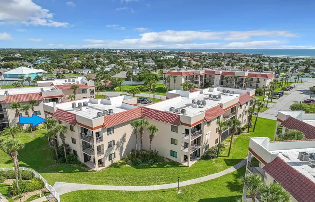 a view of swimming pool is middle in front of residential houses