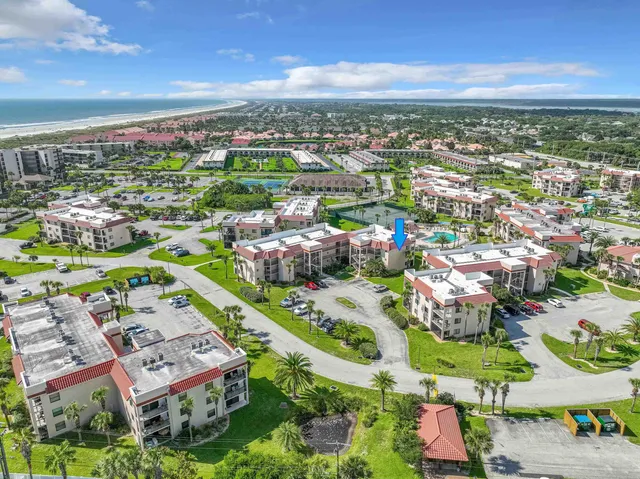 a view of a swimming pool from a garden