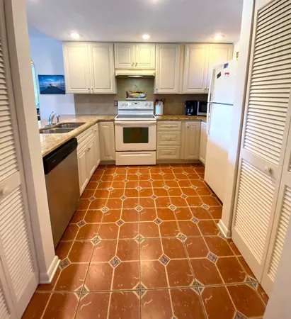 a very nice looking dining room with a table and chairs