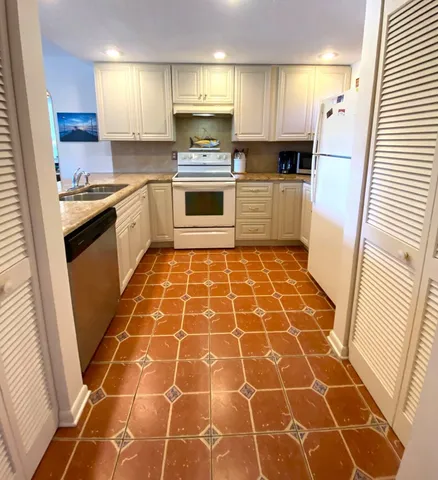 a very nice looking dining room with a table and chairs