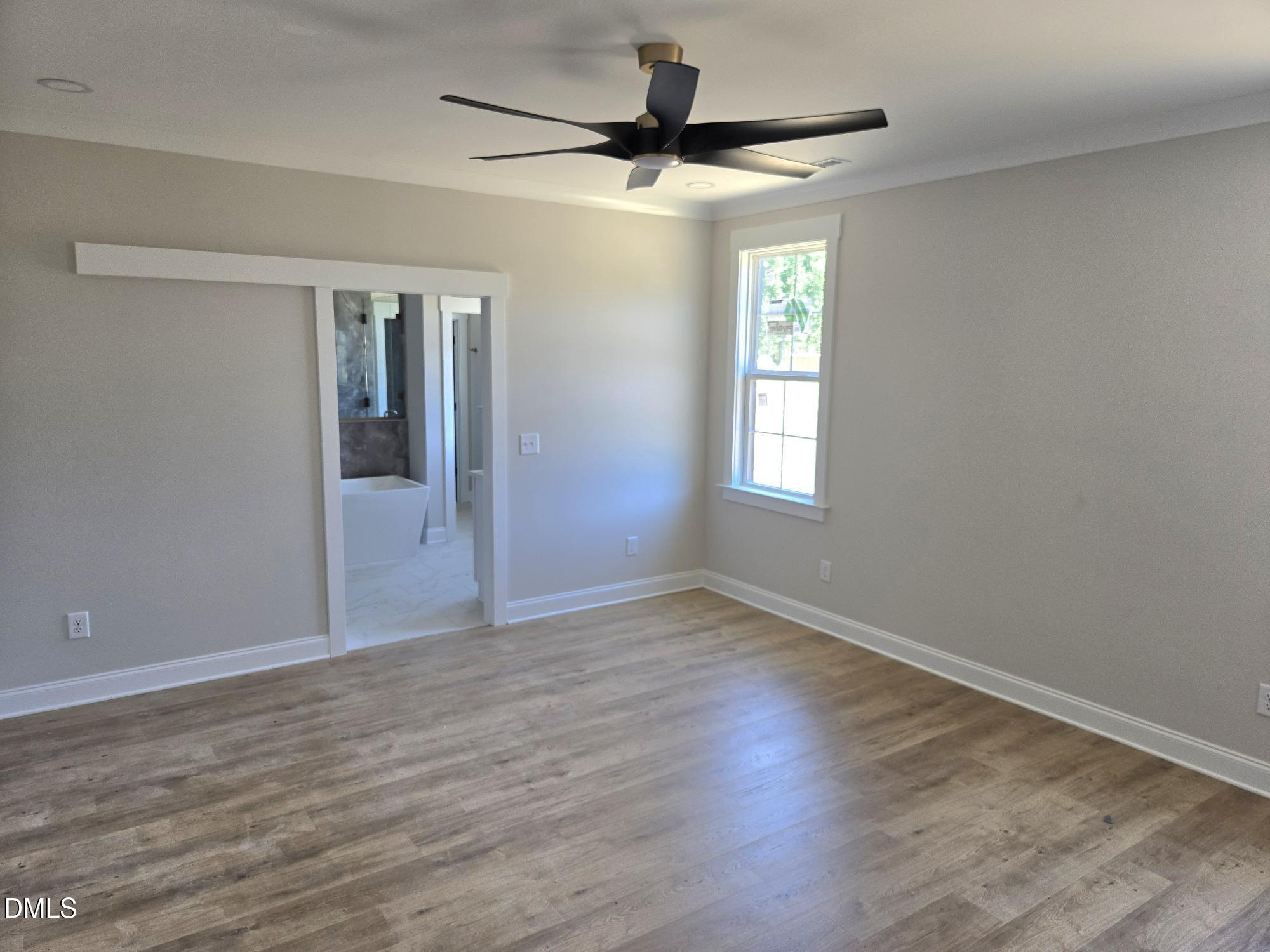 300 Avery Road Erwin, NC 28339 - Photo 25 of 38 wooden floor in an empty room with a window