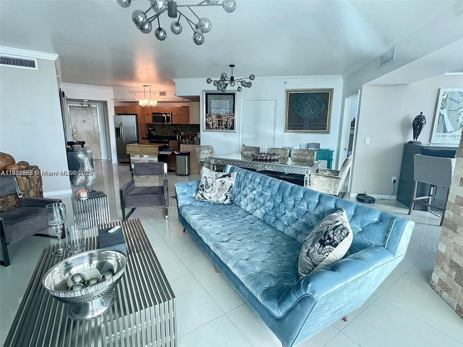 350 South Miami Avenue, Unit 3602 Miami, FL 33130 - Photo 11 of 18 a living room with furniture and a flat screen tv