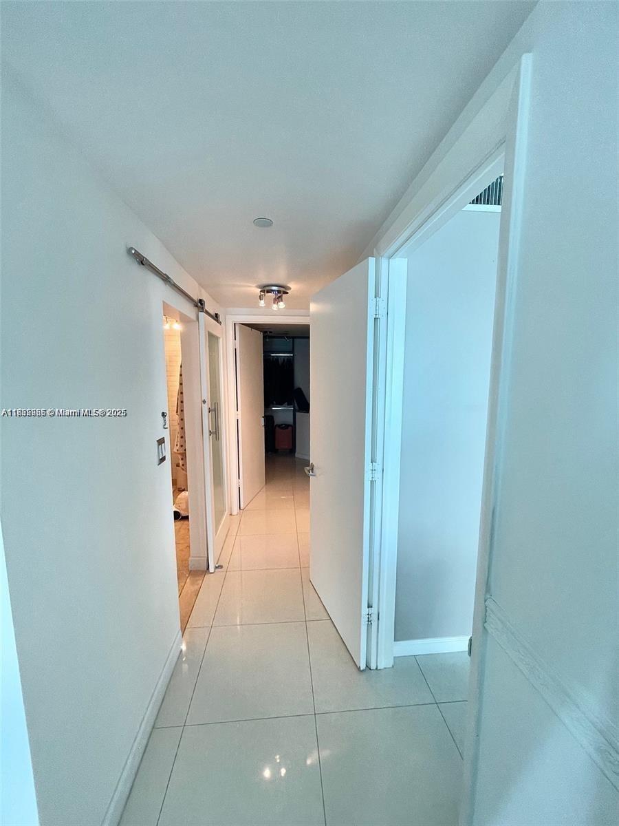 350 South Miami Avenue, Unit 3602 Miami, FL 33130 - Photo 5 of 18 a view of a hallway