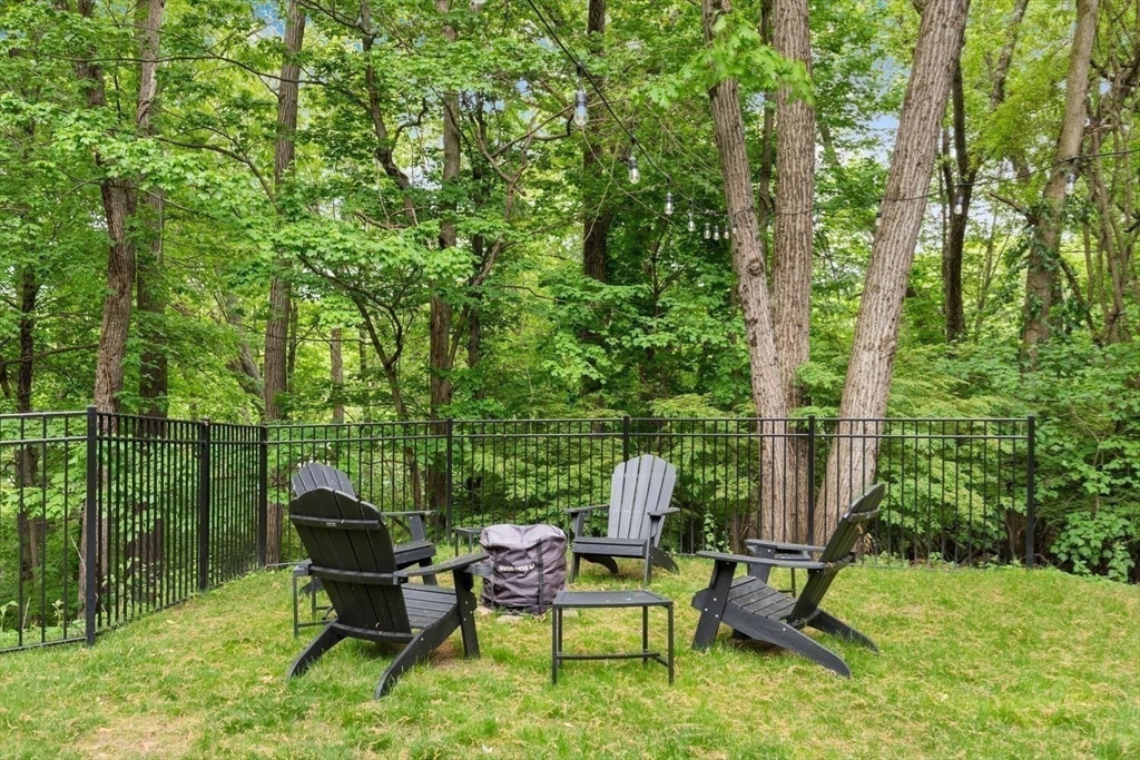 105 Thornberry Road Winchester, MA 01890 - Photo 31 of 35 a view of a two chairs in a yard
