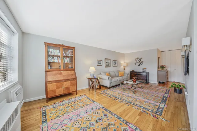 a spacious bedroom with a bed a table and chair