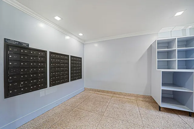 a view of an empty room with shelves
