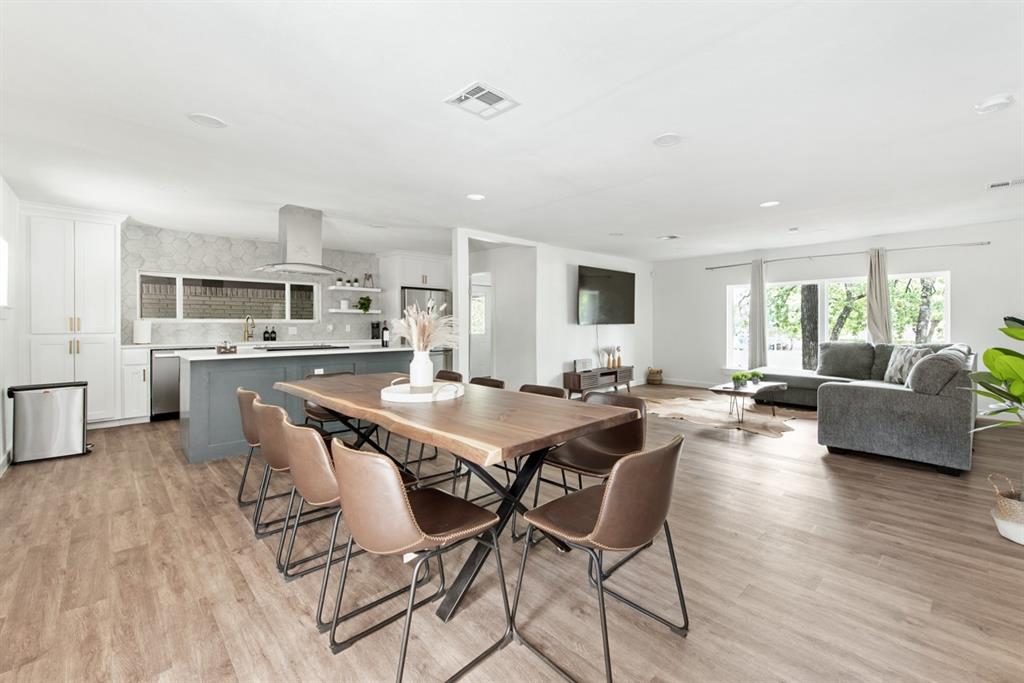 4252 McComas Road Haltom City, TX 76117 - Photo 11 of 35 a view of a dining room with furniture and wooden floor