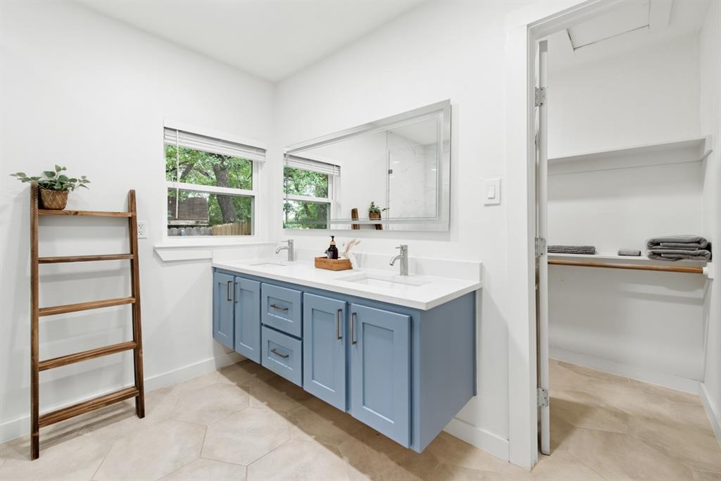 4252 McComas Road Haltom City, TX 76117 - Photo 21 of 35 a kitchen with a sink and a refrigerator