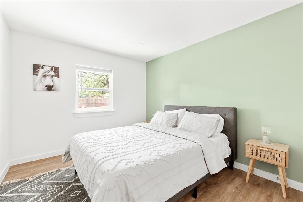 4252 McComas Road Haltom City, TX 76117 - Photo 23 of 35 a bedroom with a bed and a window