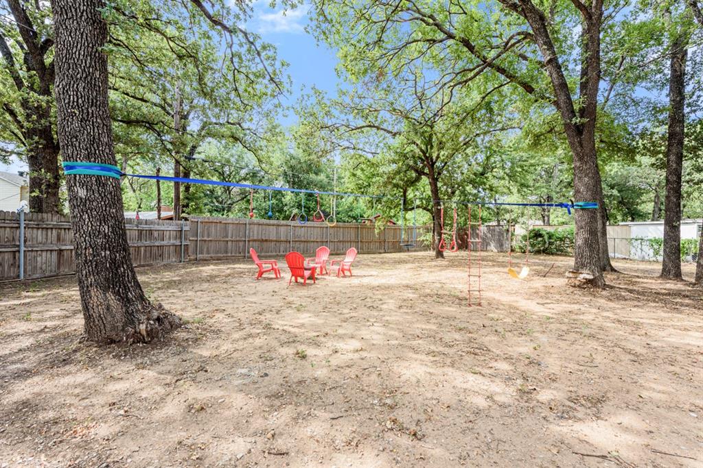 4252 McComas Road Haltom City, TX 76117 - Photo 32 of 35 a view of backyard with tree