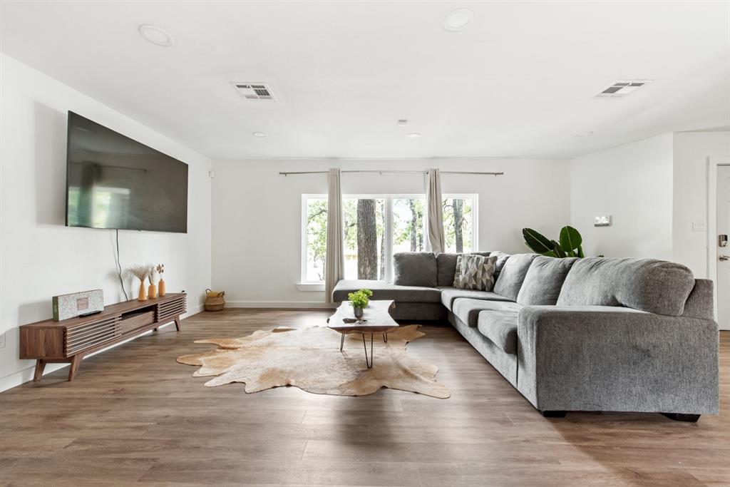 4252 McComas Road Haltom City, TX 76117 - Photo 5 of 35 a living room with furniture and a flat screen tv
