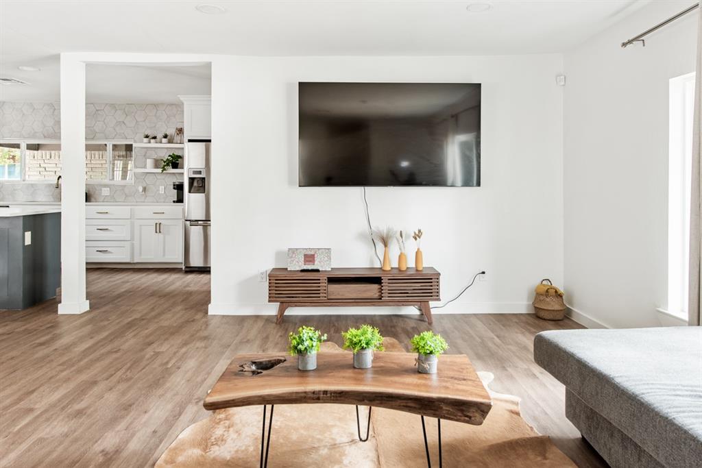 4252 McComas Road Haltom City, TX 76117 - Photo 7 of 35 a living room with furniture and a flat screen tv