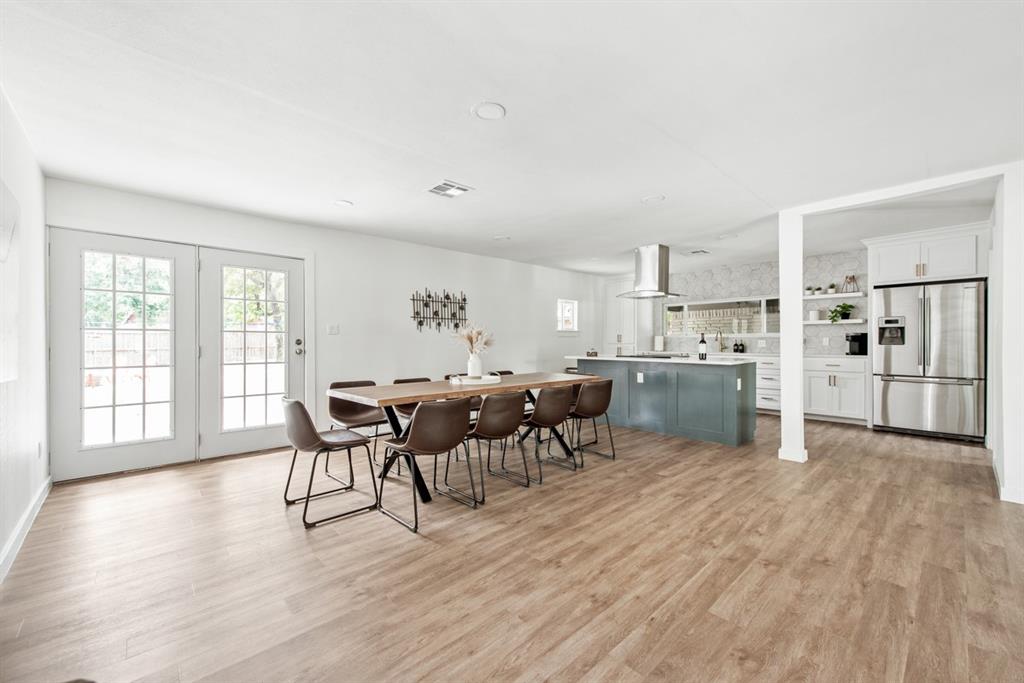4252 McComas Road Haltom City, TX 76117 - Photo 9 of 35 a view of a kitchen with dining room and wooden floor