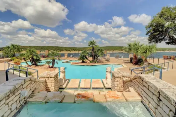 an outdoor space with patio swimming pool and outdoor seating
