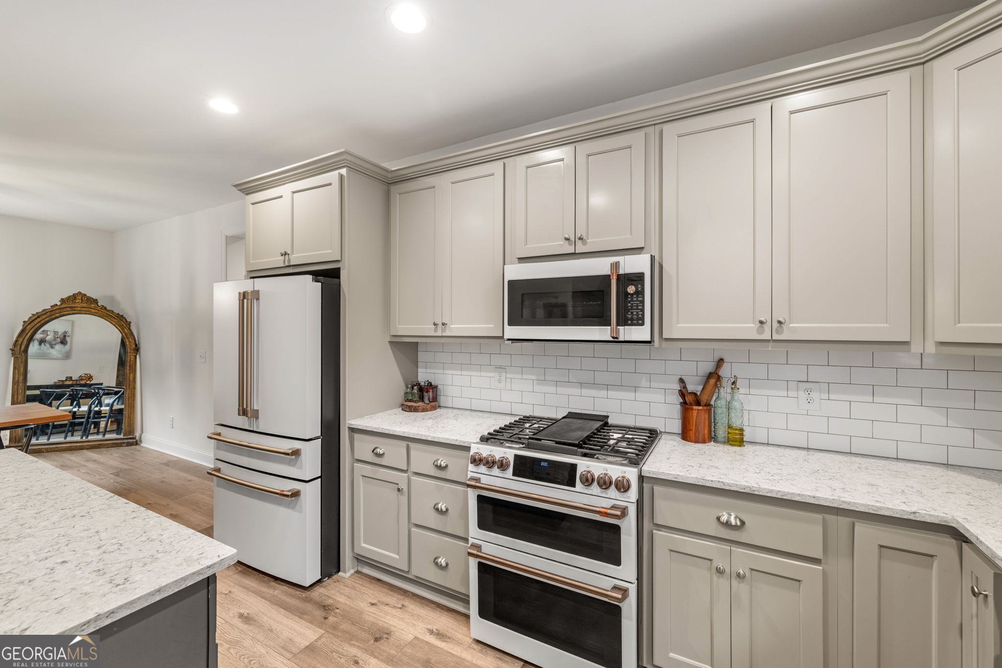 373 McIntosh Road Clarkesville, GA 30523 - Photo 11 of 92 a kitchen with stainless steel appliances granite countertop a stove a sink and a refrigerator