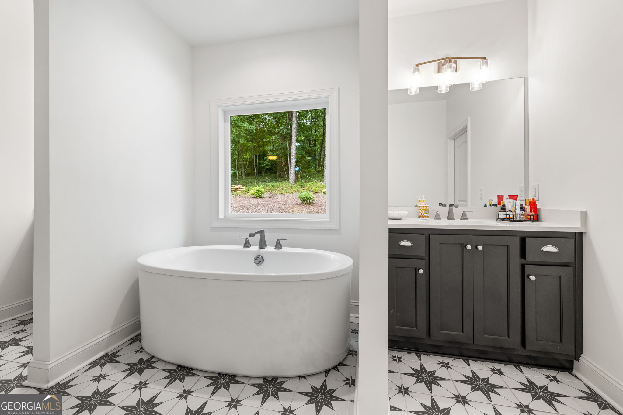 373 McIntosh Road Clarkesville, GA 30523 - Photo 17 of 92 a bathroom with a sink and a mirror