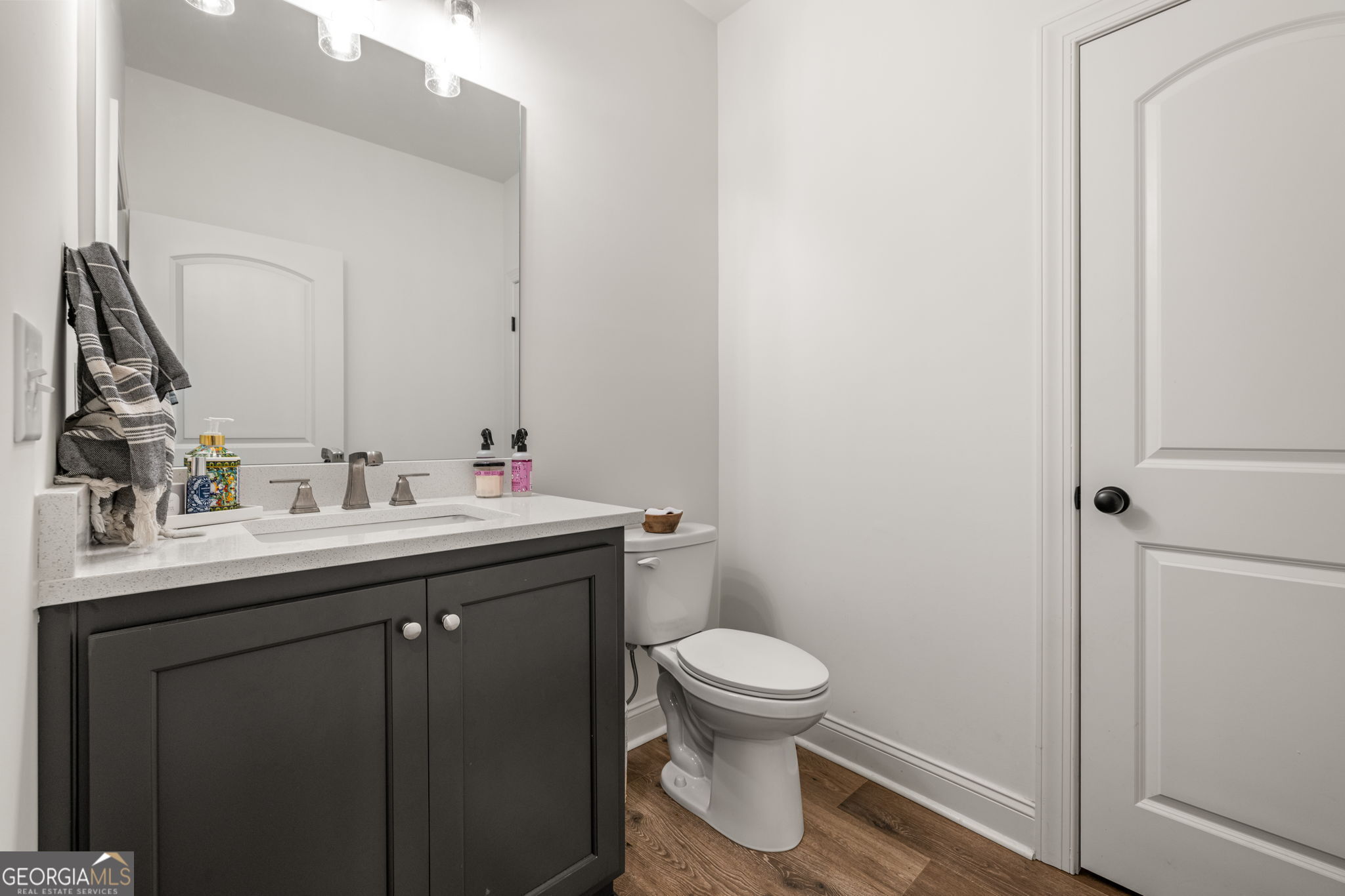 373 McIntosh Road Clarkesville, GA 30523 - Photo 20 of 92 a bathroom with a sink toilet and a mirror