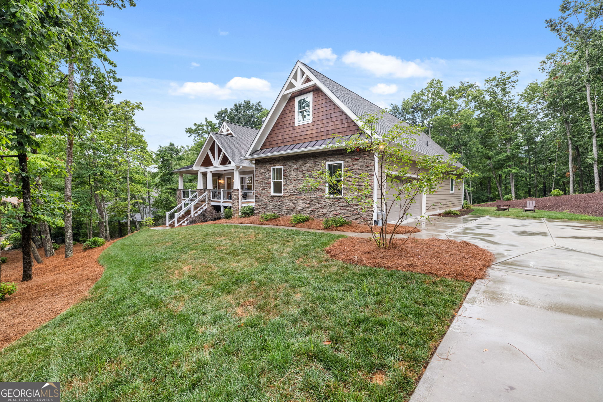 373 McIntosh Road Clarkesville, GA 30523 - Photo 36 of 92 a front view of a house with a yard and porch