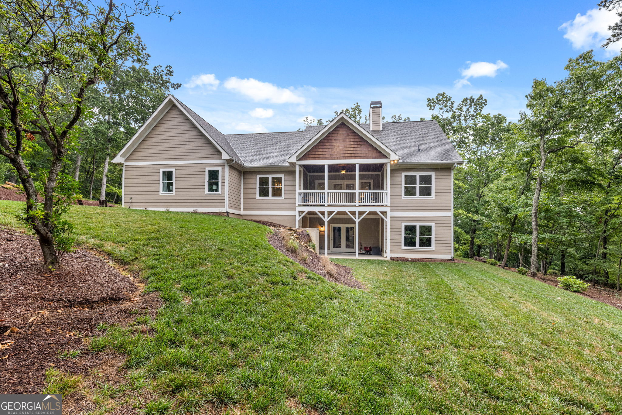 373 McIntosh Road Clarkesville, GA 30523 - Photo 37 of 92 a view of a house with a yard and potted plants