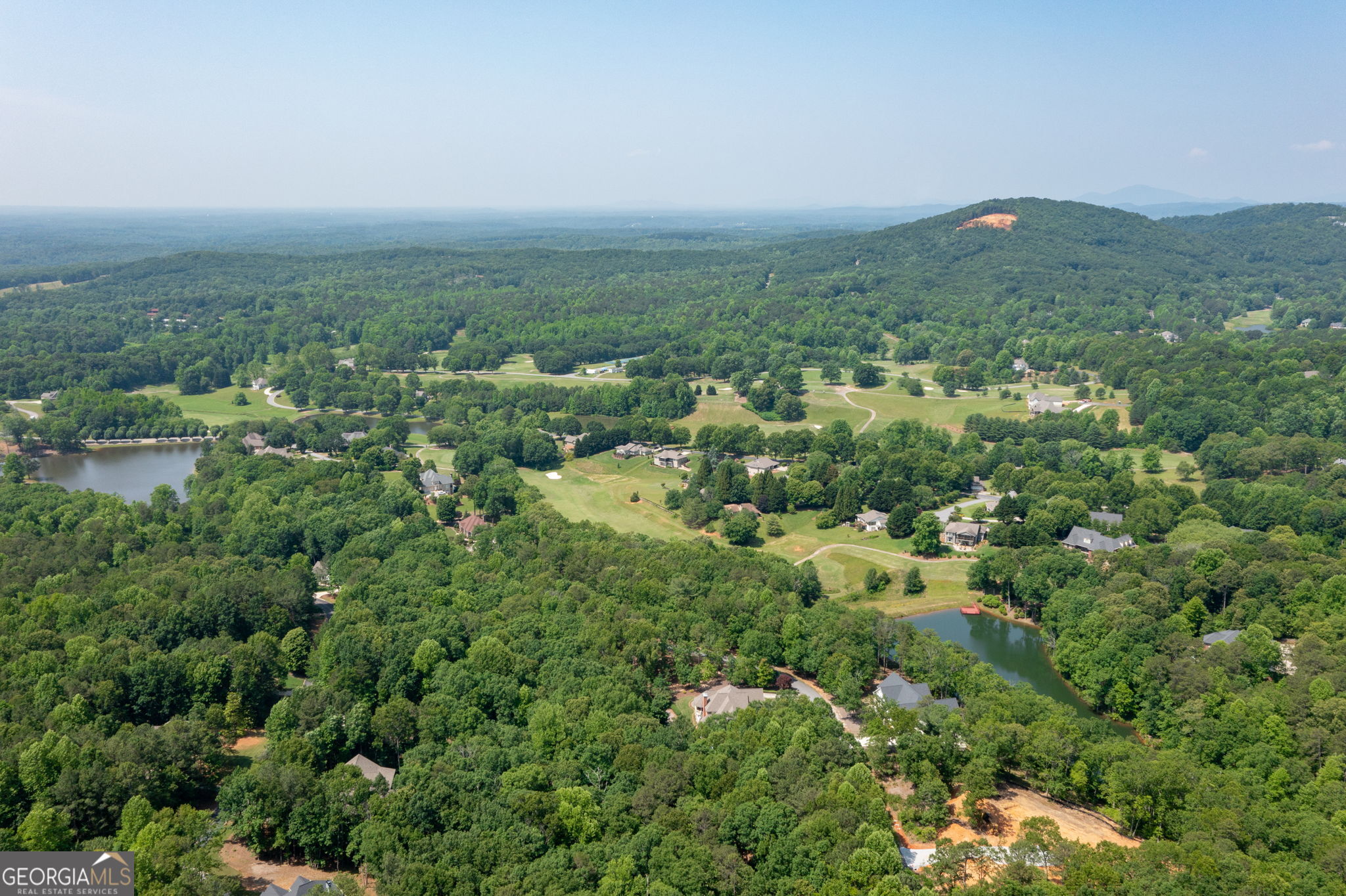 373 McIntosh Road Clarkesville, GA 30523 - Photo 47 of 92 an aerial view of residential houses with outdoor space and trees