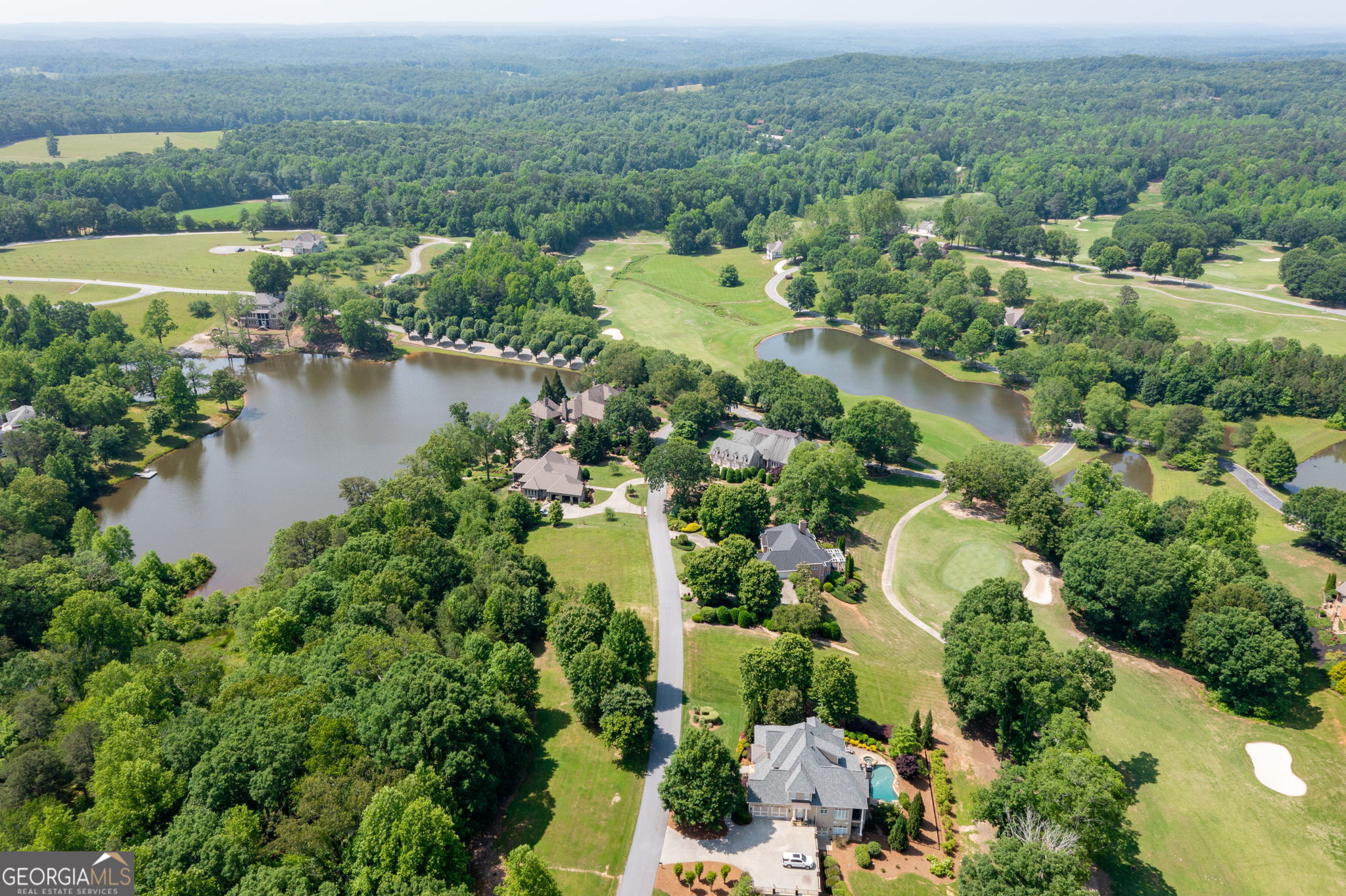 373 McIntosh Road Clarkesville, GA 30523 - Photo 50 of 92 an aerial view of lake residential house with outdoor space and trees around
