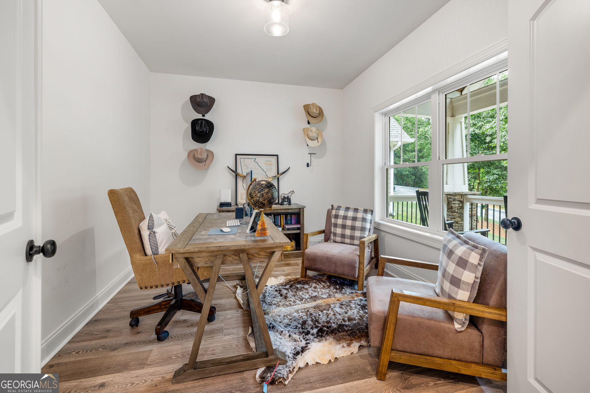 373 McIntosh Road Clarkesville, GA 30523 - Photo 5 of 92 a view of a workspace with furniture and a window