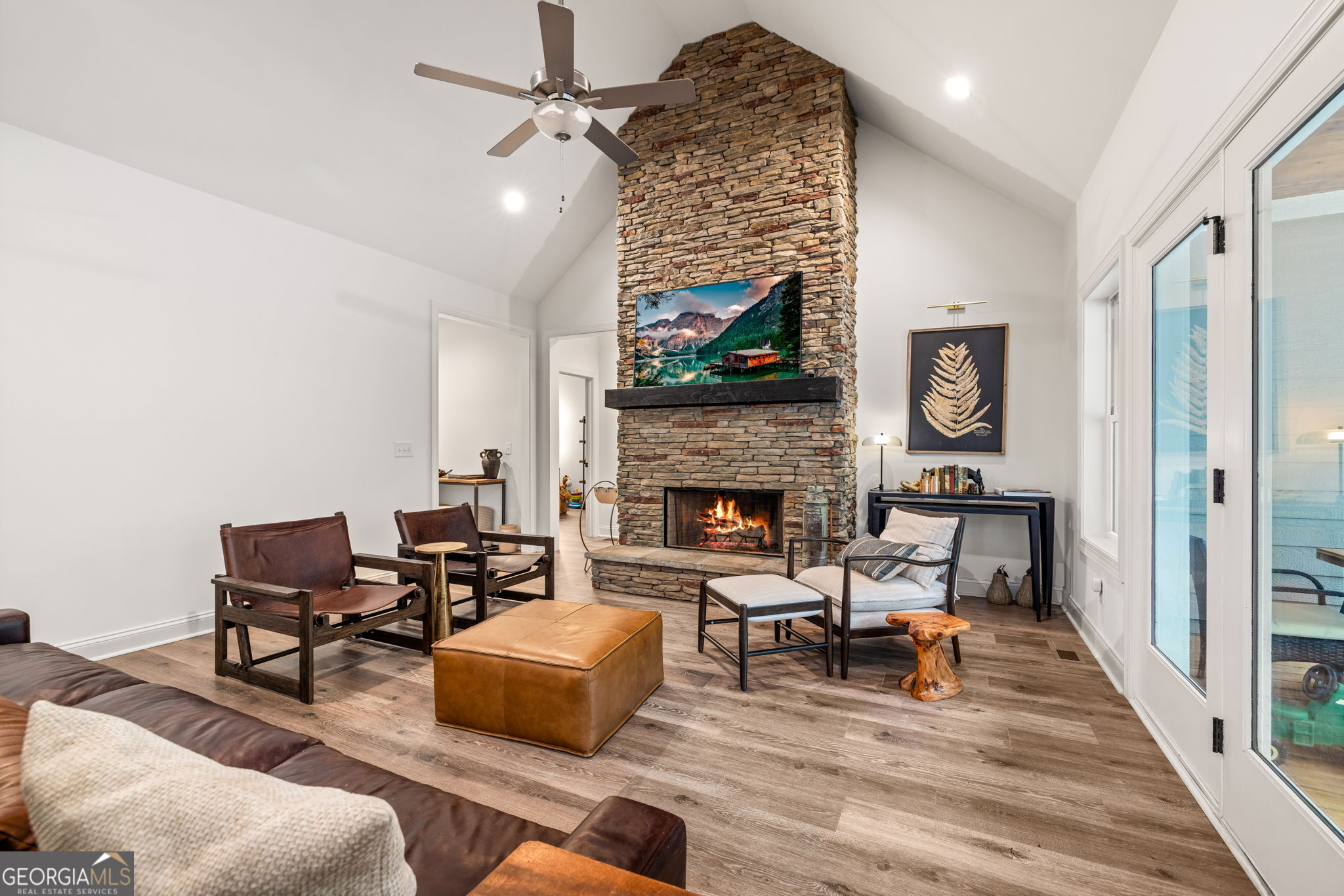 373 McIntosh Road Clarkesville, GA 30523 - Photo 7 of 92 a living room with furniture and a fireplace