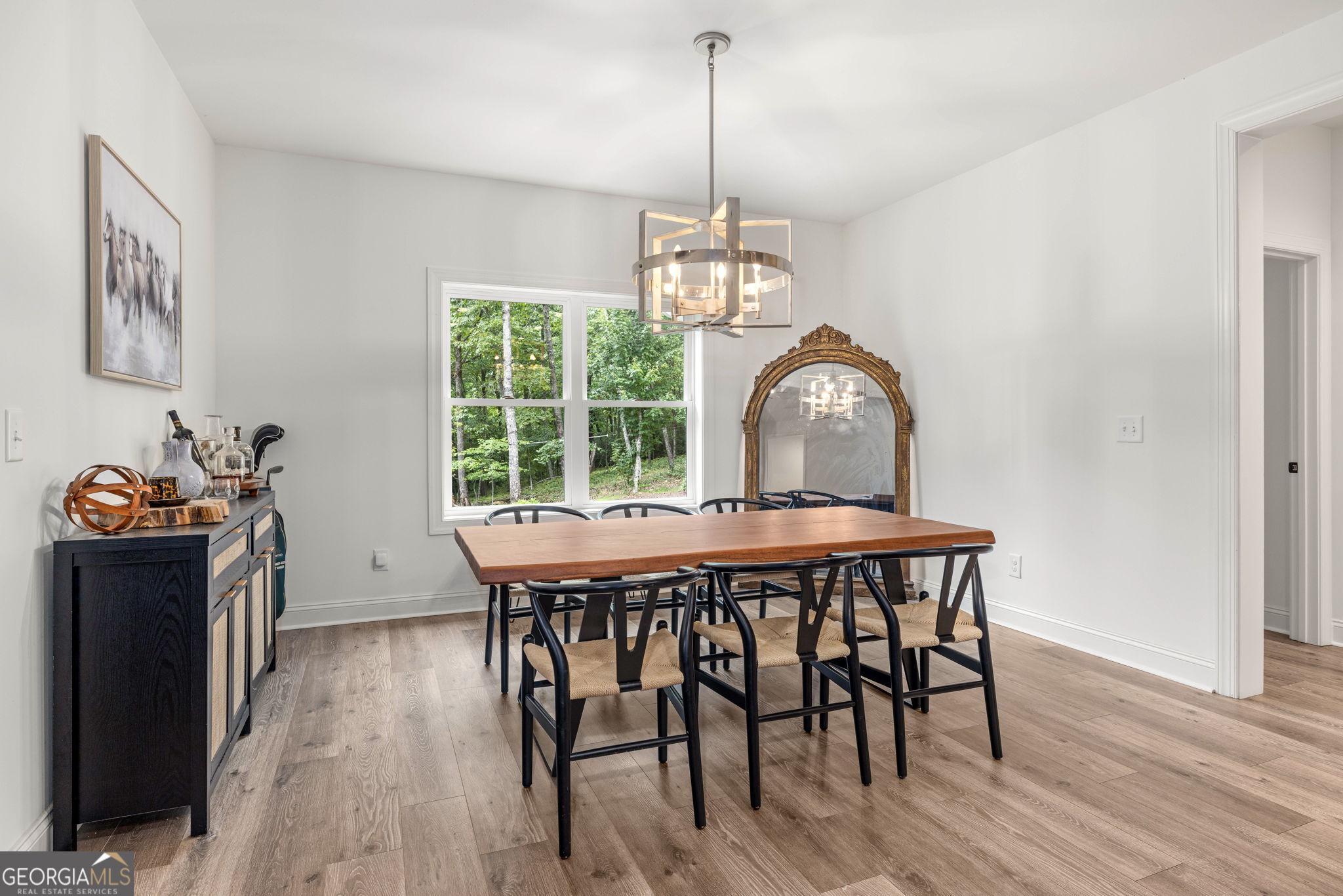 373 McIntosh Road Clarkesville, GA 30523 - Photo 8 of 92 a view of a dining room with furniture window and wooden floor