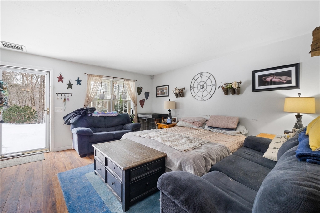 107 Center Depot Road, Unit 8 Charlton, MA 01507 - Photo 8 of 19 a living room with furniture and a table