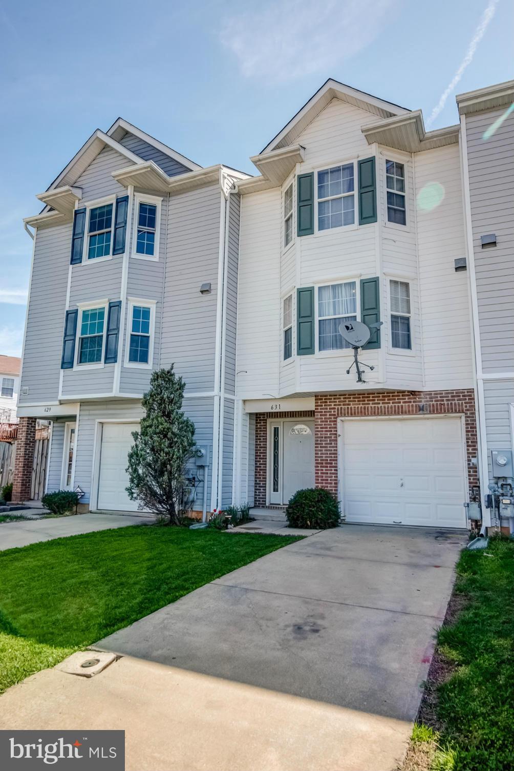 631 Hunting Fields Road Baltimore, MD 21220 - Photo 1 of 29 a front view of a house with a yard and garage