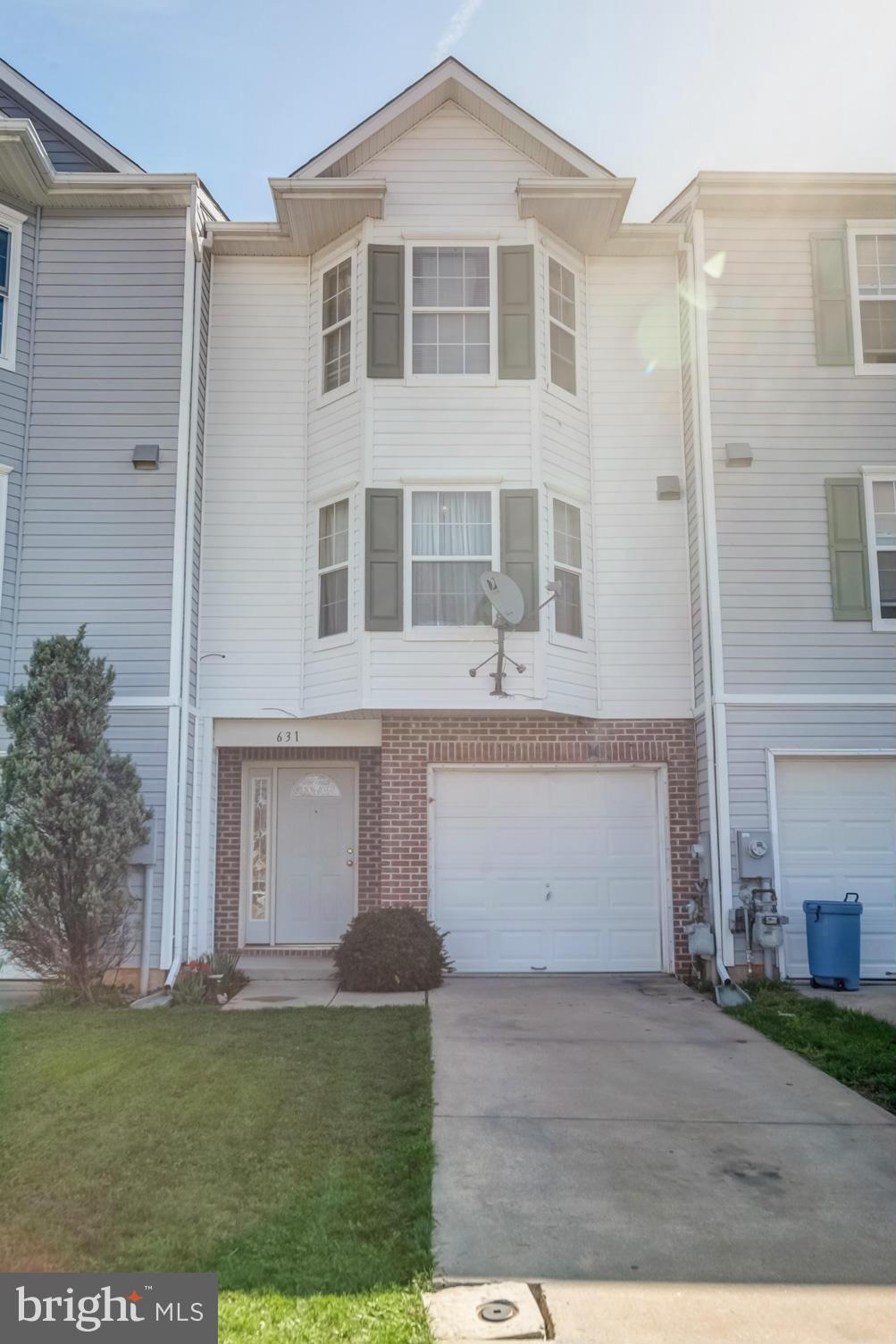 631 Hunting Fields Road Baltimore, MD 21220 - Photo 2 of 29 a front view of a house with a yard
