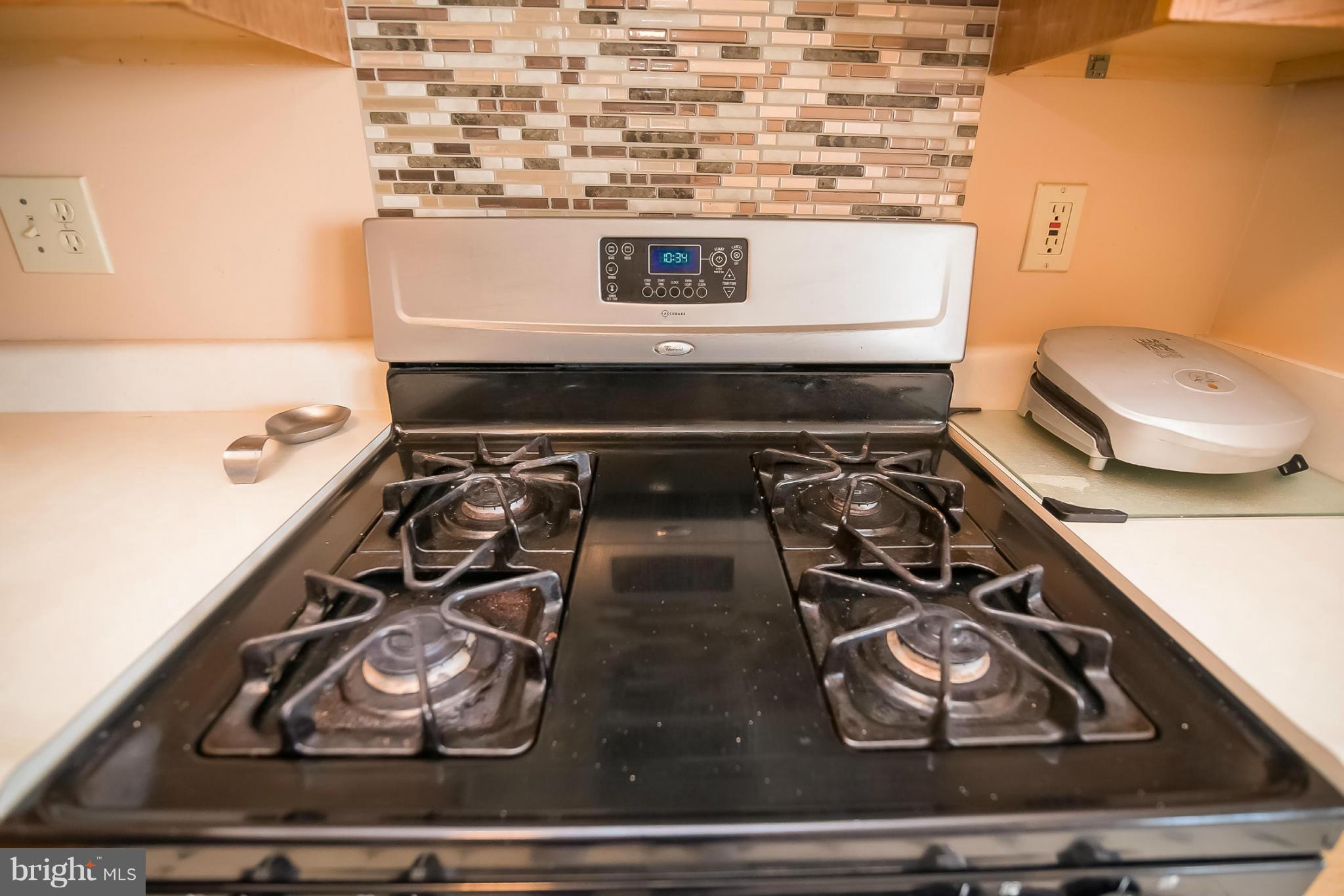 631 Hunting Fields Road Baltimore, MD 21220 - Photo 15 of 29 a stove top oven sitting inside of a kitchen