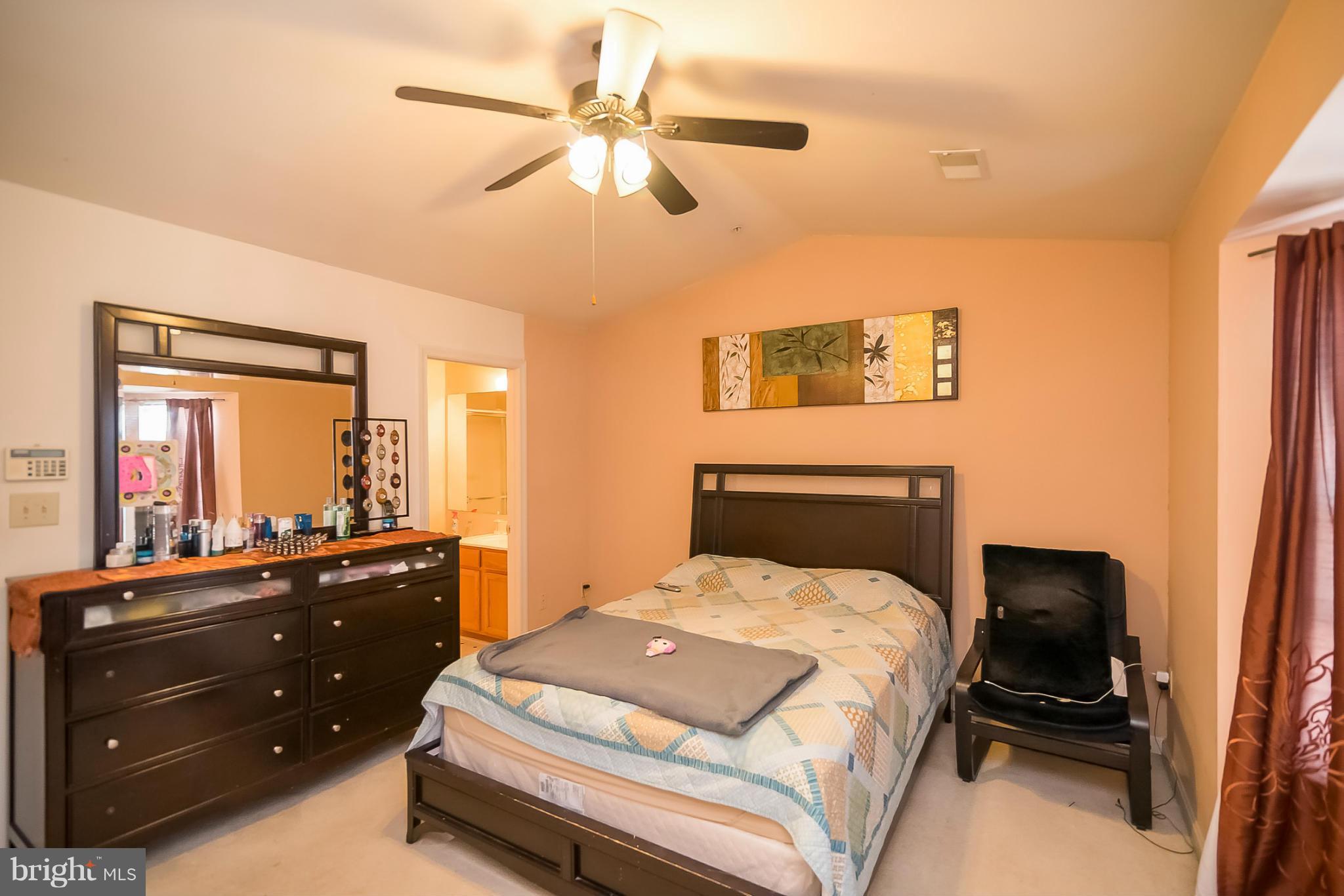 631 Hunting Fields Road Baltimore, MD 21220 - Photo 17 of 29 a bedroom with a bed and a dresser