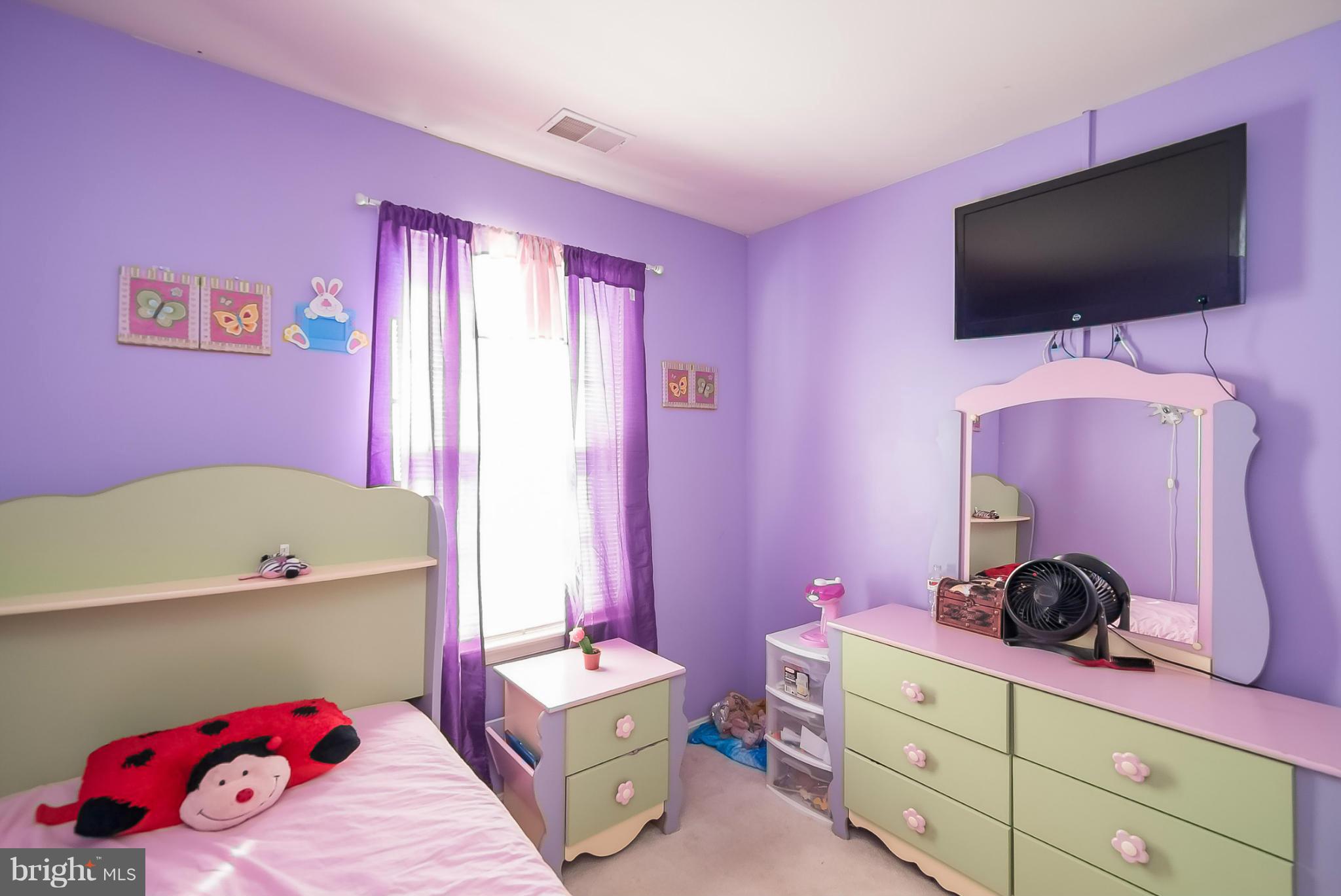 631 Hunting Fields Road Baltimore, MD 21220 - Photo 22 of 29 a bedroom with a bed and a flat screen tv