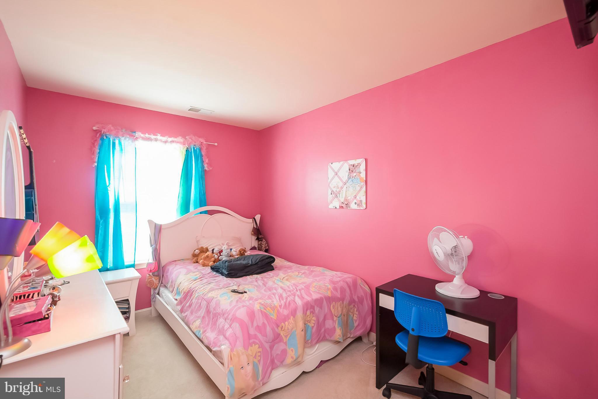 631 Hunting Fields Road Baltimore, MD 21220 - Photo 23 of 29 a bedroom with a bed and a window